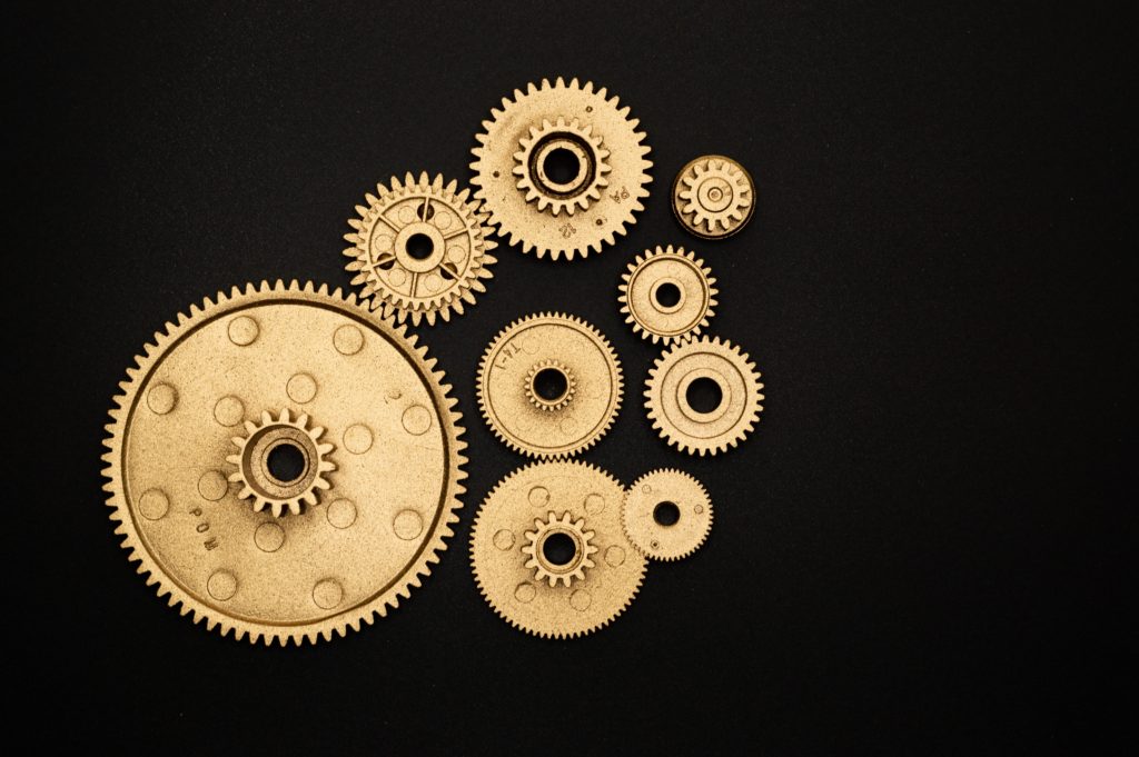 tan gears on a black background